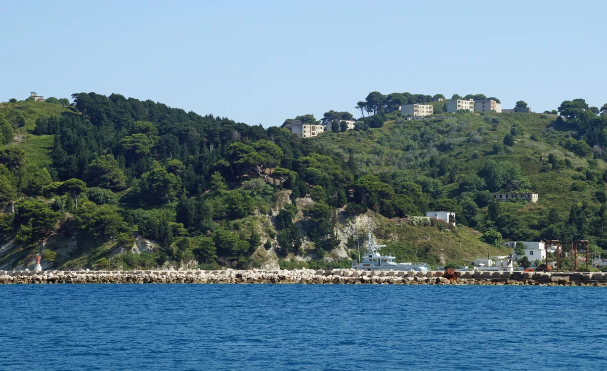 Sazan’s buildings and port, July 2018.