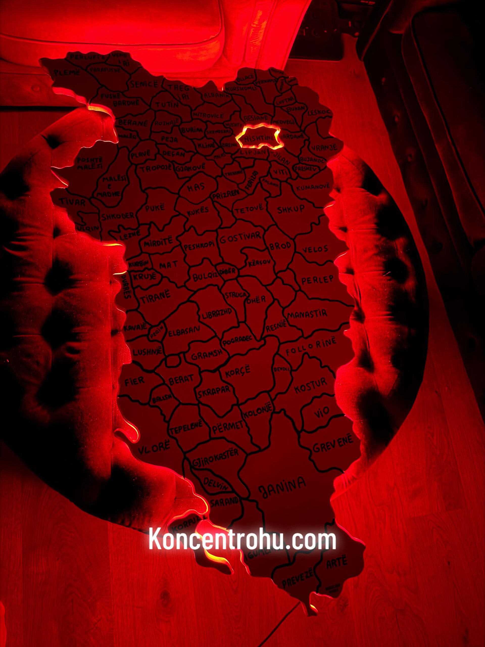 Red-lit decorative map with Prishtina highlighted and the KONCENTROHU website caption